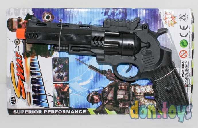 Пистолет черный на планшете, фото 1